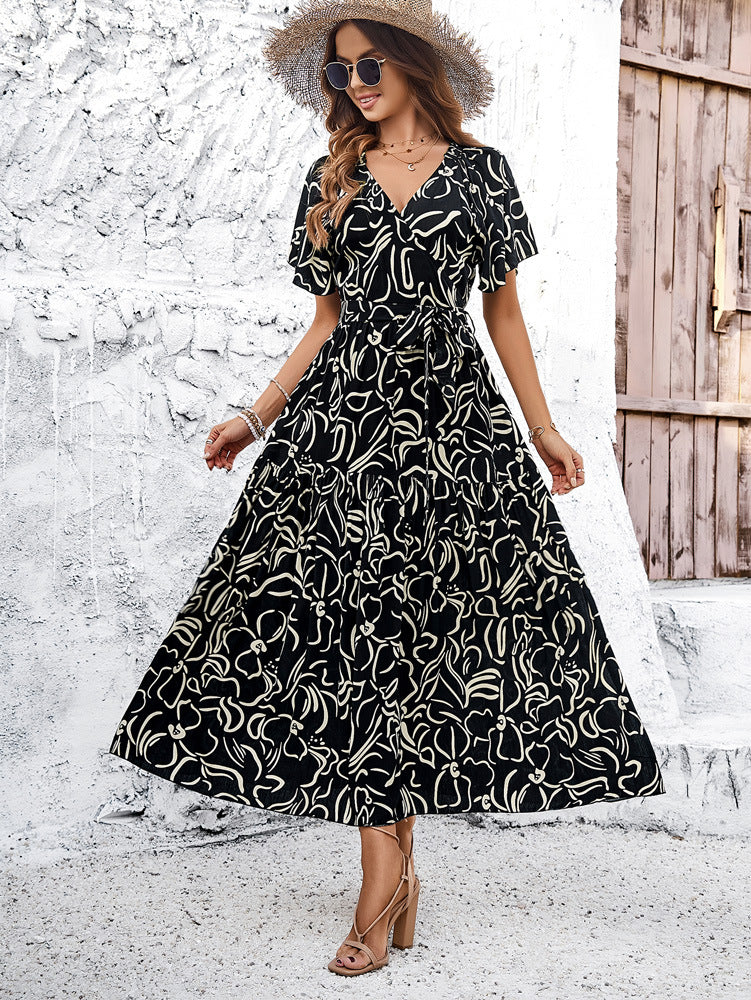 Schwarzes, ausgestelltes Kurzarmkleid im Bohemian-Stil mit tiefem V-Ausschnitt 